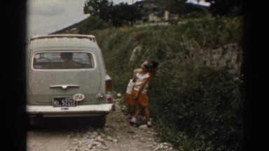 1962: three children investigate the bushes next to a parked car EPHESUS TURKEY
