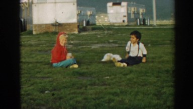 1962: Best Friends and Their Puppy Sitting in a Field Ephesus Turkey