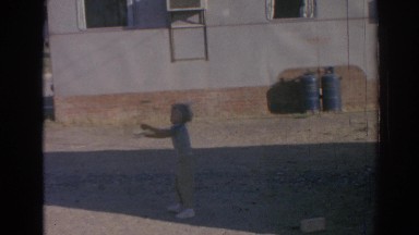 1962: cute child spinning around in open area IZMIR TURKEY