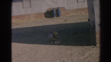 1962: little boy playing out in the driveway. IZMIR TURKEY