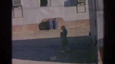 1962: young lad playing in the driveway. IZMIR TURKEY