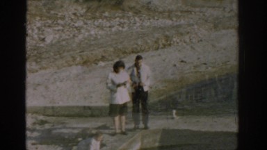 1962: couple standing on a platform near water IZMIR TURKEY
