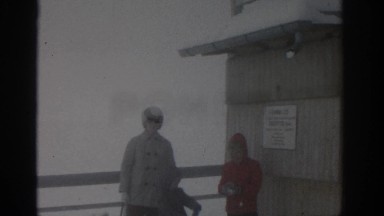 1963: Family of Three Playing in Snow Near Frozen Lake in Munich