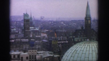 1963: A Large City at Daytime, Followed by the Wing of an Airplane in Flight
