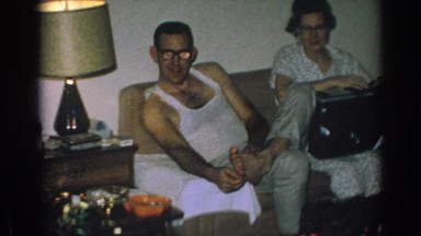 1962: Family Sits in Living Room Smiling and Talking During Christmas Morning, Gary Indiana