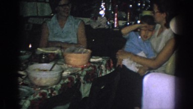 1962: family members gather around a table to enjoy food GARY INDIANA