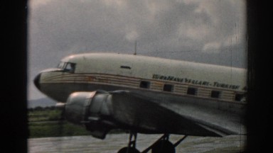 1962: Small Aircraft with U.S. Flag Pattern Moving Slowly on Runway in Izmir, Turkey