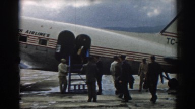 1962: People Walking Around an Airplane and Greeting Family in Izmir, Turkey