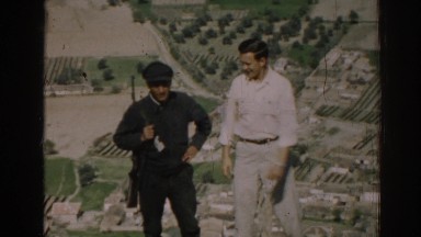 1962: two men laughing and standing in front of a landscape IZMIR TURKEY