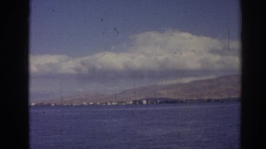 1962: it's a beautiful day to see the american flag fly over the coast