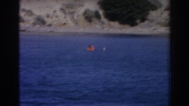 1962: man water skiing on the gorgeous lake. IZMIR TURKEY