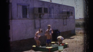 1962: little kids playing outside with their dog. IZMIR TURKEY