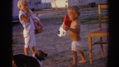 1962: a funny dog showing its love towards the kids standing scared IZMIR TURKEY