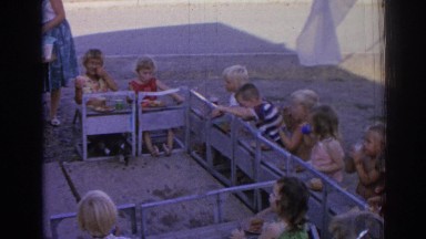 1962: children sitting turned back in the chairs in an open place IZMIR TURKEY