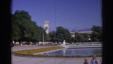 1962: children sitting in a park in front of a large pool of water IZMIR TURKEY