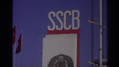 1962: lonely biker rides bicycle outside of mysterious sscb building. IZMIR