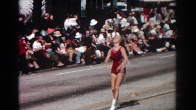 1962: a woman at a parade performs tricks with batons NEW YORK CITY