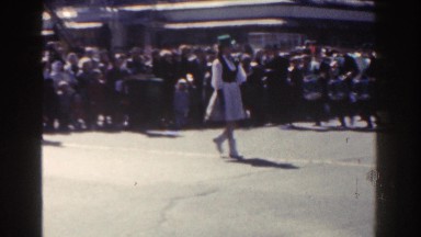 1962: members of a band walk on the street before their spectators NEW YORK CITY