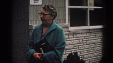 1963: woman standing out from her house. NEW JERSEY