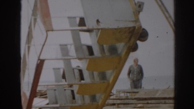 1963: tram car of white and yellow connected panels, vintage clip
