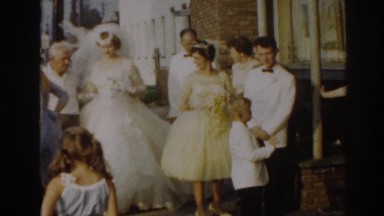 1963: a bride and her family gathered outside by the parking lot NEW JERSEY