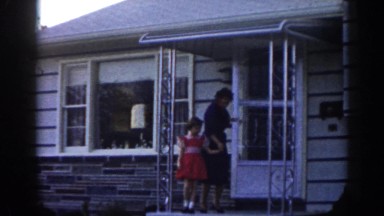 1963: mother and daughter leaving their house. NEW JERSEY