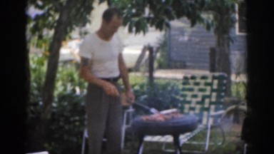 1963: man cooking a meal on the grill NEW JERSEY