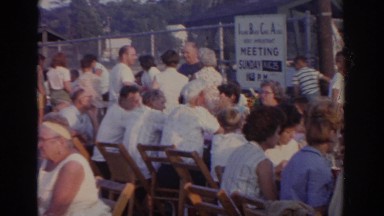 1963: large event with a lot of people sitting around eating and talking