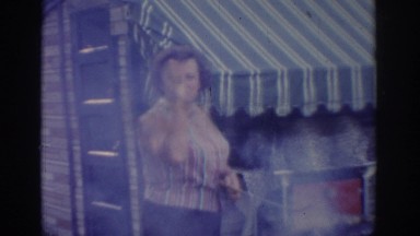 1963: summer fun with grandma and grandpa involves dancing while grilling.
