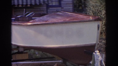 1963: little boat parked in front of the house, not rolling without wheels under