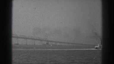 1937: Ship in the Channel Enters the Area of a Large Magnificent Bridge