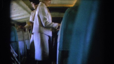 Airline Hostesses Distribute Customs Slips to Passengers in Los Angeles
