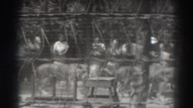 1937: people watching the lions walking in their cage. EL MONTE CALIFORNIA