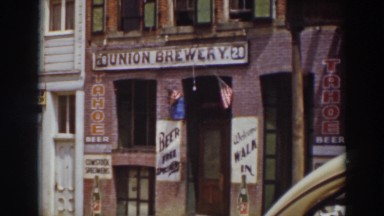 1937: taking a lovely picture of an old brewery with many signs