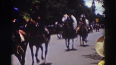 1937: horses and wagons traveling through a small town. TRUCKEE CALIFORNIA