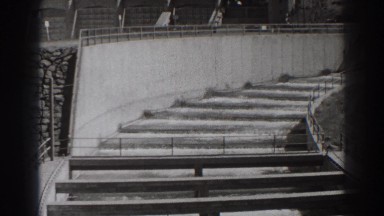 1938: water traveling down some steps. BONNEVILLE DAM OREGON