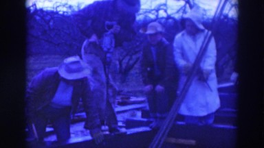 1937: a group of workers doing some work on wood with drillers SACRAMENTO