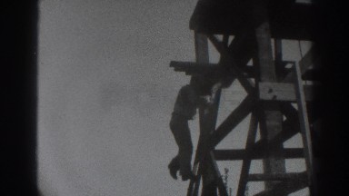 1937: man climbing down SACRAMENTO CALIFORNIA