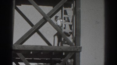 1937: person standing on a huge, industrial structure. SACRAMENTO CALIFORNIA