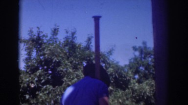 1937: farmer installs pipe in his orchard. SACRAMENTO CALIFORNIA