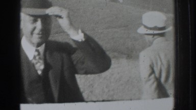 1937: two old gentlemen wearing suits and hats are standing in a field VACAVILLE
