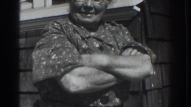 1937: woman standing and talking beside her house. VACAVILLE CALIFORNIA