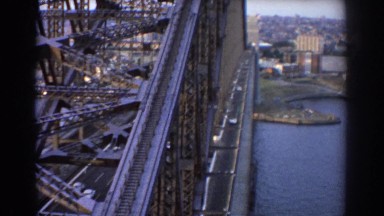 1967: massive steel bridge over water with cars driving across it SYDNEY