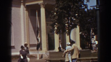 1939: Many People Dressed-Up Walking Outside of a Large Building New York Worlds