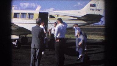 1967: men gathered at an airport BRISBANE AUSTRALIA