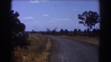 1967: paved roadway through a wooded rural area. BRISBANE AUSTRALIA