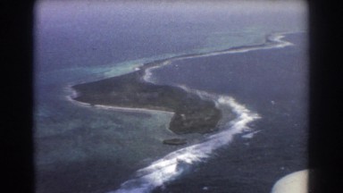 1967: aerial view of the coast from a plane during a sunset. PERTH AUSTRALIA