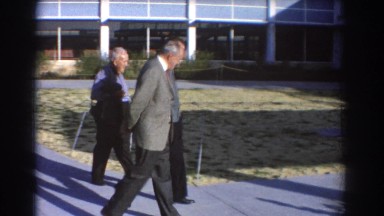 1967: men walking along the sidewalk at the office. PERTH AUSTRALIA
