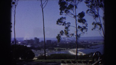 1967: view of a city in the distance surrounded by water PERTH AUSTRALIA