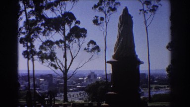 1967: view of a statue on a hill overlooking a beautiful city